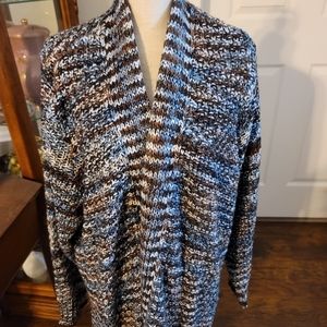 Avenue size 26/28 sweater. Blue, brown, navy and tan. New without tags.